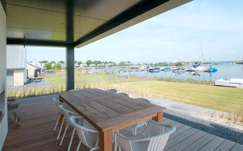 Oesterdam Resort: Water, Eigendom, Lucht, Tafel, Schaduw, Buitenmeubels, Hout, Stoel, Boot, Buitentafel