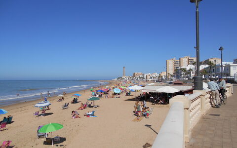 Apartamento Caracola: Water, Lucht, Strand, Straatlantaarn, Fiets, Schaduw, Zand, Horizon