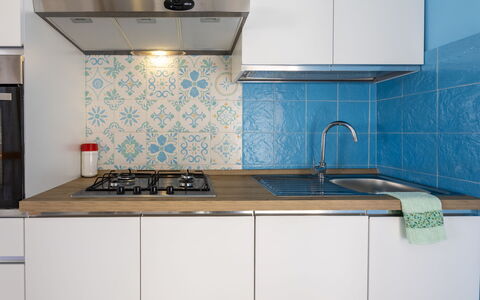 Mariposa: Keuken, Major Appliance, Flooring, Toestel Van De Keuken, Countertop, Verdieping, Fornuis, Fornuis, Gootsteen, Interieur Ontwerp
